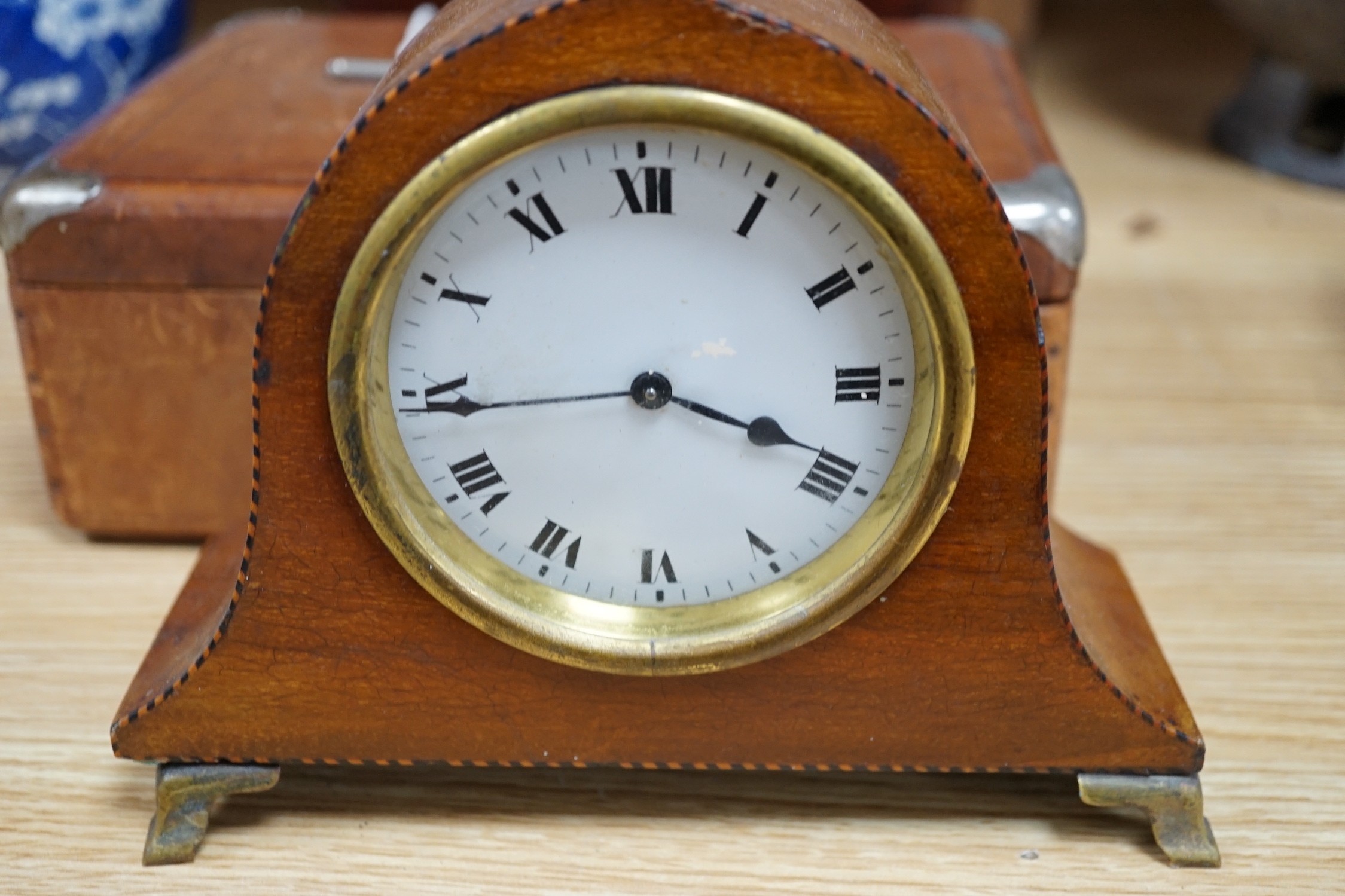 A 19th century mahogany tea caddy, writing slope, leather box and mantel clock, largest 30cm wide